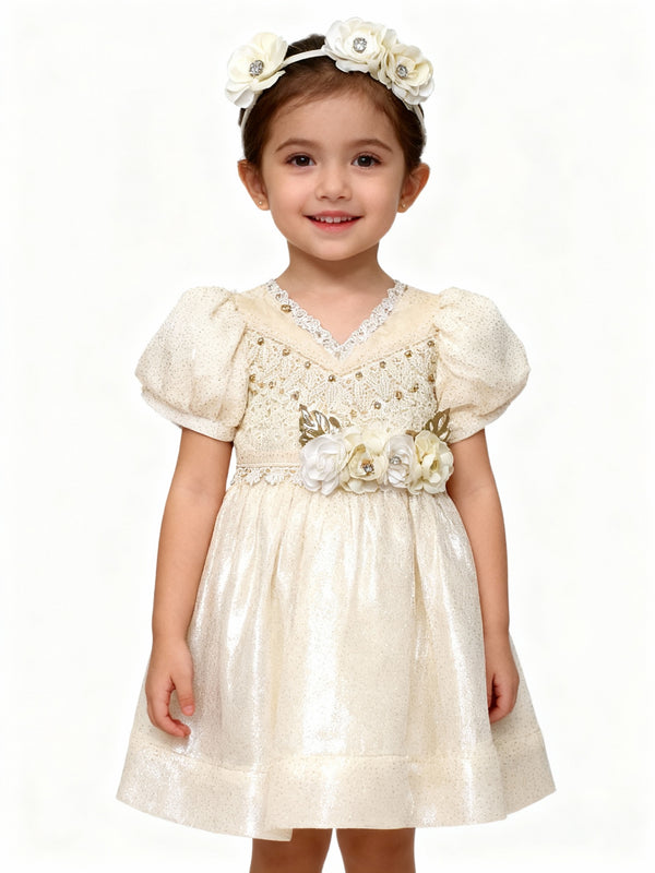 Young girl wearing a white floral dress with a matching headband on a white background